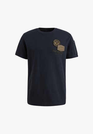 Mørkeblå bomulds t-shirt med korte ærmer. Udstyret med to dekorative lapper på brystet og en lille lomme på venstre ærme.