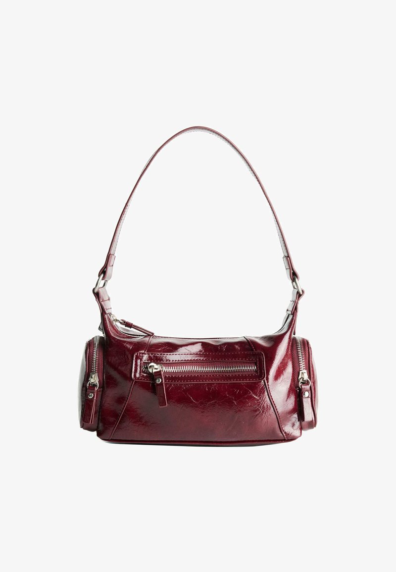 Shiny dark red leather shoulder bag with a front zipper pocket and two small zipped side compartments.