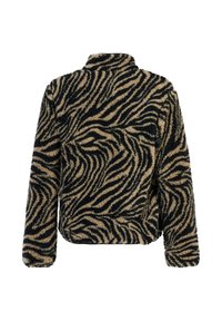 Veste en polaire avec manches longues et col montant, présentant un motif rayures zèbre beige et noir.