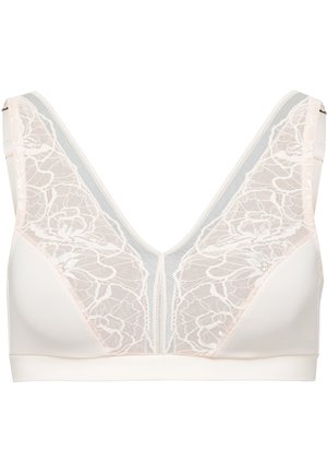 Kanten bralette in zachtroze met een V-halsontwerp, voorzien van bloemmotieven op de cups en een soepele band. Inclusief verstelbare bandjes.