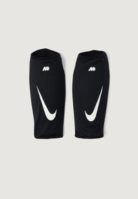 Mangas de fútbol de malla negra con el logo de Nike en blanco. Presentan aberturas elásticas para un ajuste ceñido, textura uniforme y un diseño transpirable.