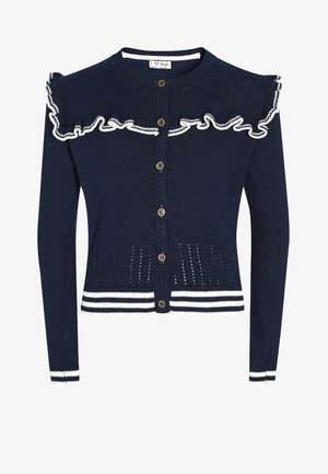 Cardigan bleu marine à boutons avec détails volants blancs sur les épaules et ourlet et poignets rayés blancs, en tissu tricoté.