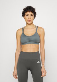adidas Performance YOGA ESSENTIALS LIGHT-SUPPORT - Sutiã desportivo de suporte ligeiro - blue oxide