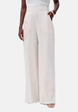 blue shadow MUSAKA - Trousers - white