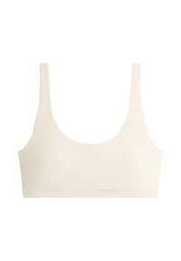 Nahtloser, cremefarbener Bralette mit breiten Trägern und einer strukturierten diagonalen Rippenstruktur, entworfen für Komfort und leichte Unterstützung.