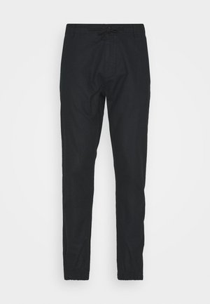 Schwarze, leichte Hosen mit elastischem Bund und Kordelzug. Slim-Fit-Design mit schmal zulaufenden Beinen und ohne sichtbare Muster oder Akzente.