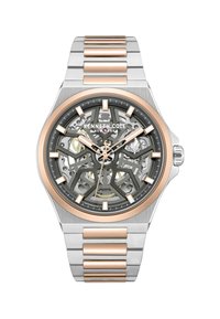 Szkieletowy automatyczny zegarek ze stali nierdzewnej w kolorze srebrnym i różowymi złotymi akcentami. Posiada szary cyferblat, skomplikowany wzór oraz znaczniki godzin.