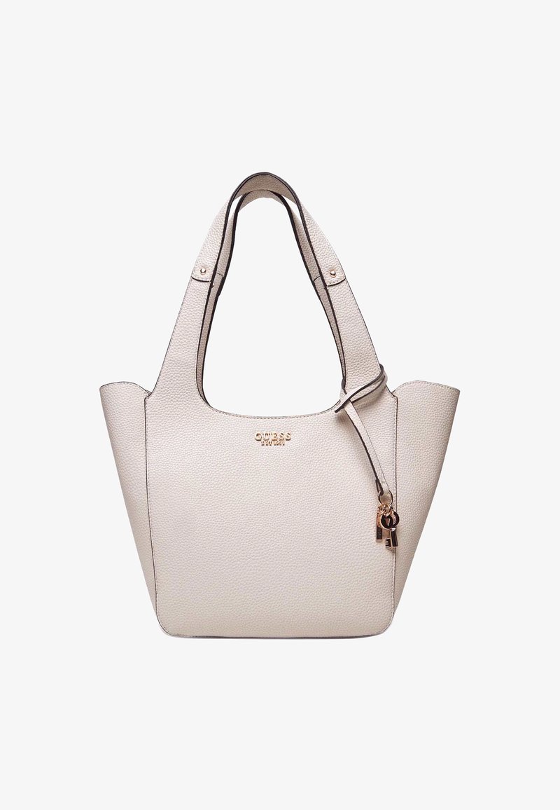 Sac fourre-tout structuré beige avec texture granuleuse, finition noire, double anses et un accessoire porte-clés décoratif.