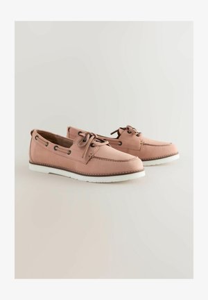 Heledad roosat nahast paadikingad valge kummitaldaga, ümmarguse varbaga, nööbiga sulgemise ja külgmiste ventilatsiooniaukudega.