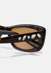 Swarovski Akiniai nuo saulės - brown