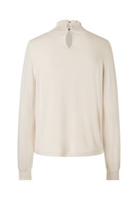 Langärmlige, cremefarbene Bluse mit einem gerafften hohen Kragen und einem Schlüsselöffnungsdetail am Rücken, ausgestattet mit gerafften Manschetten für eine figurbetonte Optik.