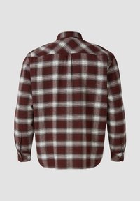 Geruite flanellen blouse in bordeaux en wit. Heeft lange mouwen, een kraag en knoopmanchetten met een detail aan de achterkant.