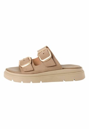 Helle Wildleder-Pantoletten mit zwei verstellbaren Schnallen, einer gepolsterten Fußbett und einer klobigen hellbeigen Gummisohle.