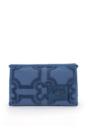 Blue fabric clutch with textured geometric pattern and a dark blue patch labeled "V°73 VENEZIA" on front center.