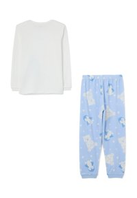 Weißes langärmliges Oberteil kombiniert mit blauen Schlafanzughosen, die ein Muster von Pinguinen und Eisbären auf weißen Pünktchen zeigen.