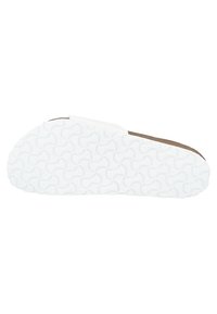 Semelle de chaussure avec un fond en caoutchouc blanc présentant un motif circulaire, un bord supérieur marron et une surface texturée pour l'adhérence.