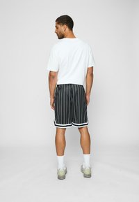 Karl Kani 2 PACK - Treningo apatinė dalis - black pinstripe white