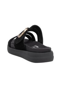 Black suede sandal with a contoured footbed, wide three-strap design, and gold-tone metal accent. Soft textured surface and platform sole.