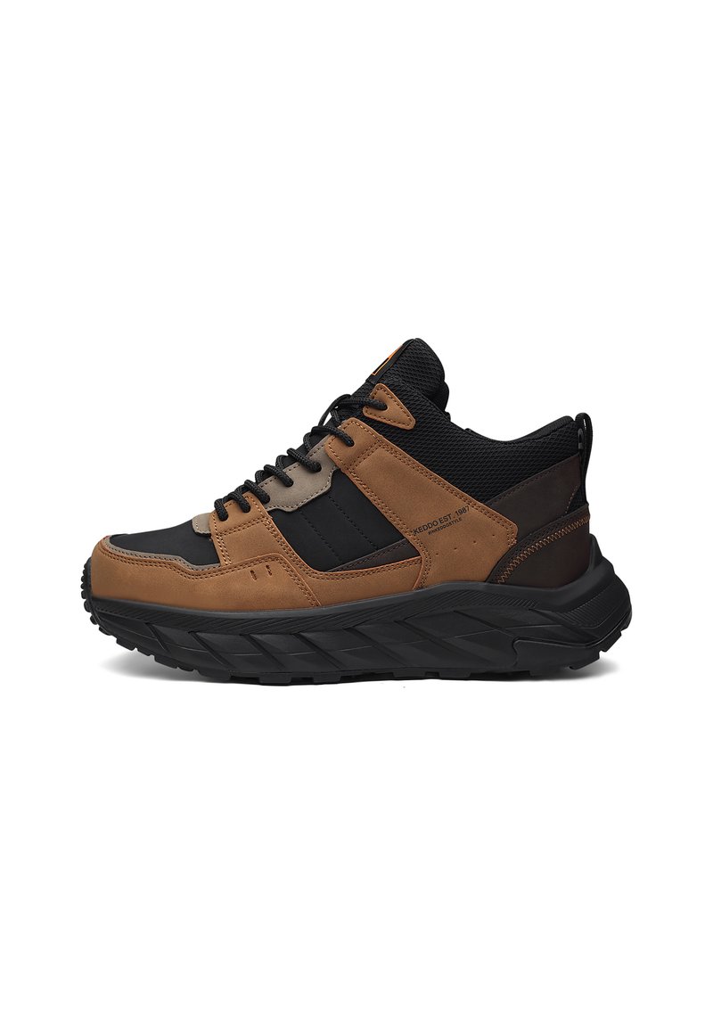 Brown and black synthetic and suede sneaker with a thick black sole, lace-up front, mesh accents, and minimal branding on the side.