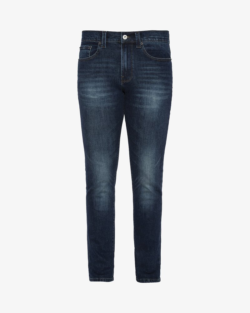 Ciemnoniebieskie dżinsy o slim fit, z zapięciem na guzik, pięcioma kieszeniami i delikatnym spraniem na udach i kolanach.