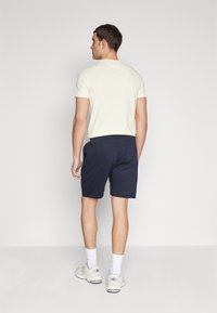 Tommy Hilfiger SMALL LOGO - Pantalones deportivos - desert sky