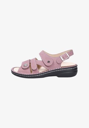 Light purple open-toe sandal with adjustable straps, cushioned insole, black sole, and a silver buckle on the heel strap.