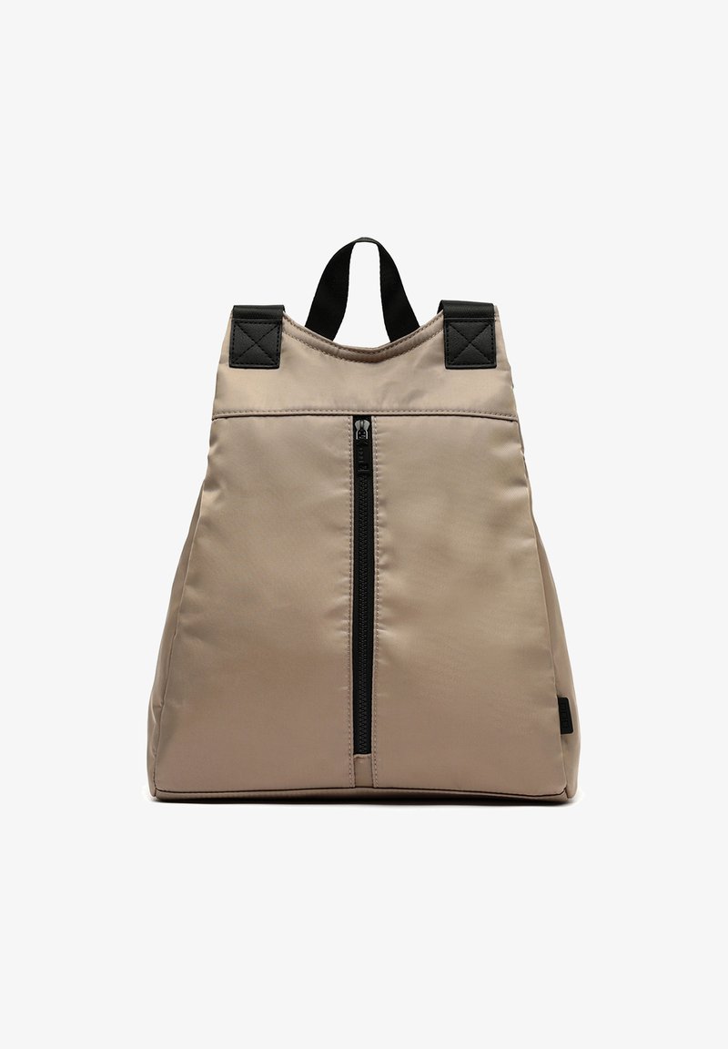 Beige nylon backpack with a triangular shape, front zipper pocket, and black accents on the straps and top handle. Smooth texture.