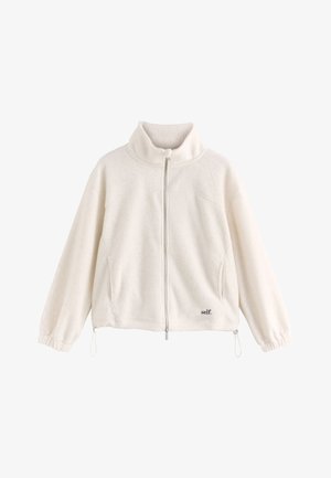 White fleece zip-up jacket with high collar, elastic cuffs, drawstring hem, and small black "self." text on lower front right side.