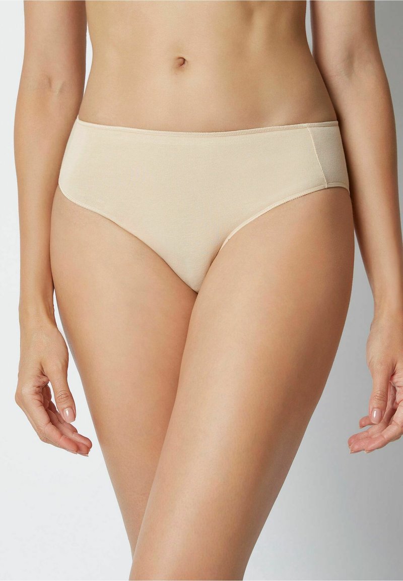Beige cotton hipster panties with a smooth texture, featuring a mid-rise waist and no visible seams for a seamless look. Stretch fabric for comfort.