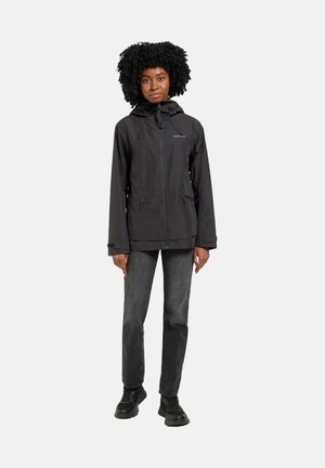 Black waterproof jacket with a zippered front, adjustable hood, and two front pockets, paired with grey jeans and black shoes.