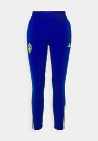 Modré sportovní kalhoty s emblémem žluté švédské vlajky a žlutým logem adidas, vyrobené z hladkého, elastického materiálu s zipy v oblasti kotníků.
