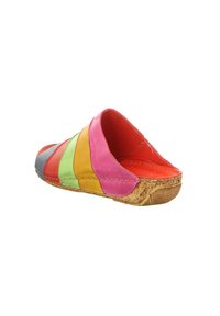 Multicolored slip-on shoe featuring leather patches in pink, yellow, green, orange, and gray, with a cork sole and exposed stitching.