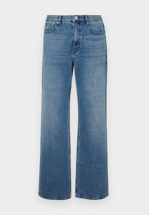 Široké modré džíny vyrobené z denimu s vybledlým povrchem. Mají pět kapes, přední zapínání na knoflík a rovný střih.