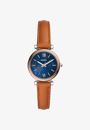 Rund ur med blå skive, rosaguld-etui, romertal ved 12 og 6, og brun læderrem, der viser tiden 10:11:36.