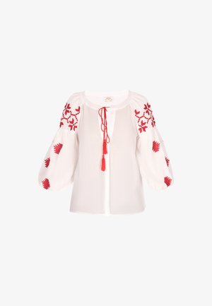 Biała bluzka z czerwoną haftowaną florą na bufiastych rękawach, z pliską i związaniem na troczki. Miękki, teksturowany materiał.