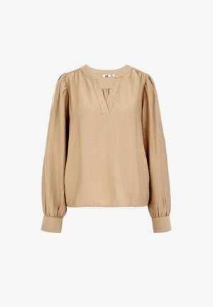Beige long-sleeve blouse made of lightweight fabric. Features a rounded neckline, pleats at the front, and fitted cuffs. Minimalist design.