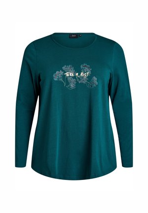 T-shirt à manches longues bleu canard avec un col rond. Présente des motifs floraux et le texte « prends un repos » en police claire. Matière douce.