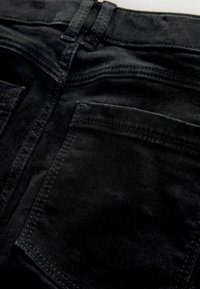 Black denim jeans featuring a smooth texture, traditional five-pocket design, and straight-leg cut, with detailed stitching and belt loops.