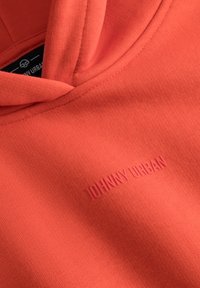 Koraal hoodie gemaakt van een katoenmix, met een kangoeroezak en een klein reliëflogo op de voorkant. Glad materiaal, verstelbare capuchon.