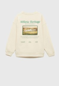 Kremowy polarowy sweter z prążkowanymi mankietami i dolnym wykończeniem, z graficznym nadrukiem przedstawiającym scenę golfową oraz napisem "Athletic Heritage" w kolorze zielonym.