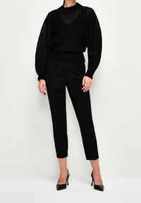 adL Stickad tröja - black