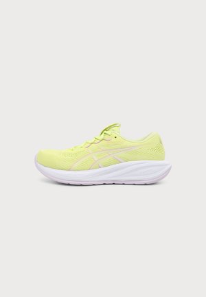 Light green lace-up running shoe with pink accents, breathable mesh upper, and thick white cushioned sole angled sideways on plain background.