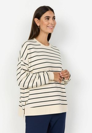 Cream sweatshirt with black horizontal stripes, crew neckline, dropped shoulders, and side slits. Soft fabric with a relaxed fit.