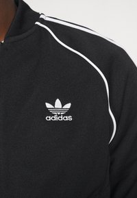 adidas Originals Cipzáras pulóver - black/white