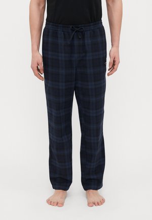 Navyblauwe geruite pyjamabroek met een elastische tailleband en trekkoord, met een zachte textuur en een relaxed fit. Geen zichtbare zakken.