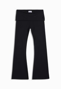 Leggings neri a svaso realizzati in un tessuto elastico con una vita ampia. Texture liscia con un design minimalista e senza modelli o parti metalliche visibili.