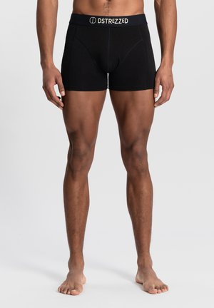 Sorte bomulds boxer briefs med en elastisk talje, der har "DSTREZZED" logo. Fitted design, ingen synlige mønstre eller detaljer.