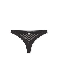 Tanga negra con detalles de malla semitransparente y con patrón. Presenta un corte triangular y tirantes entrecruzados en la parte posterior para un diseño adicional.