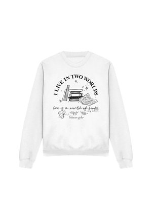 White sweatshirt with black illustration of stacked and open books, text "I live in two worlds" and "One is a world of books" with Gilmore Girls reference.
