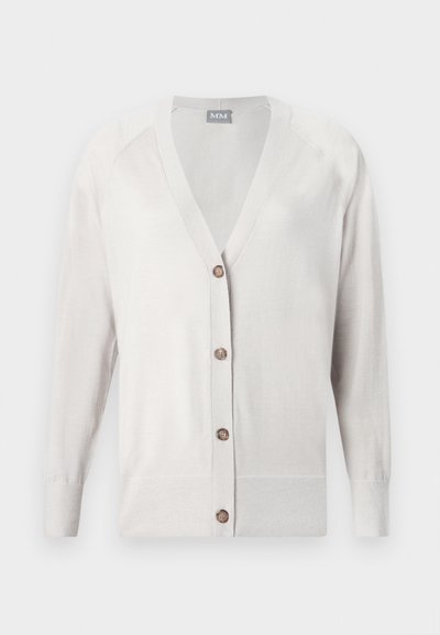 Φαρδιά μπεζ ζακέτα με μακριά μανίκια και κουμπιά, V-λαιμόκοψη και τέσσερα καφέ κουμπιά, πλεκτά μανσέτες και στενή εφαρμογή.